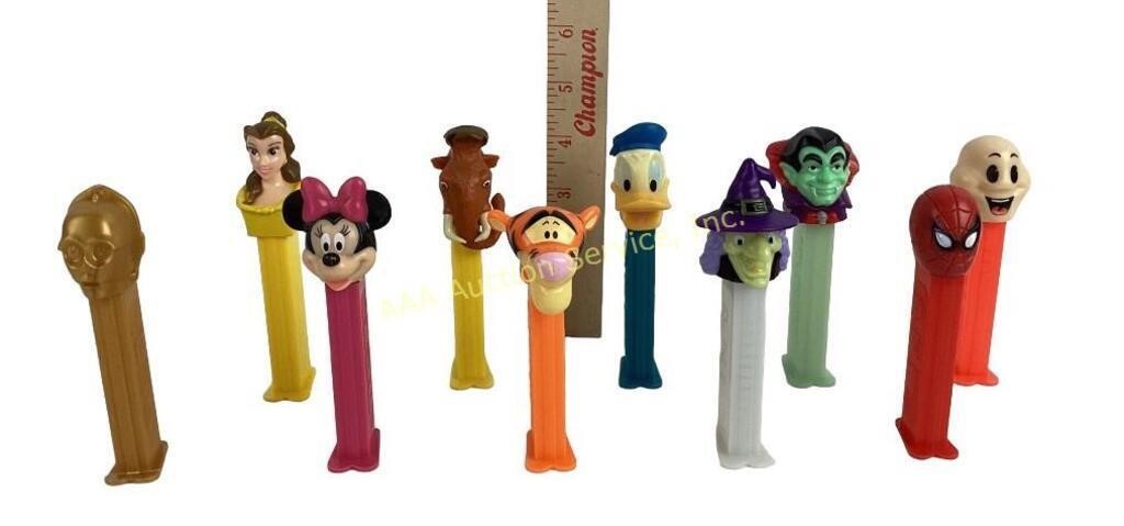 Pez dispensers. Belle, tigger, Donald Duck, face,