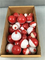 Box of various sized bobbers