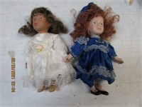 Ceramic dolls white dress blue dress