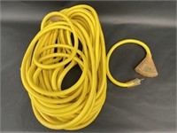 Large Yellow Extension Cord and Carol Power Strip