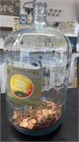 5 gallon glass water jug with pennies
