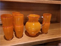 Orange/red art Deco pitcher & cups. Den