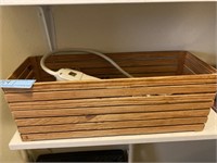 Wooden box with CDs and surge protector