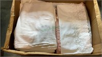 Box lot of linens and rugs.  Includes sheets,