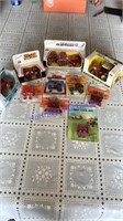 10 - 1/64 scale toy tractors, on cards