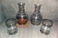 Two Decanters with Glasses
