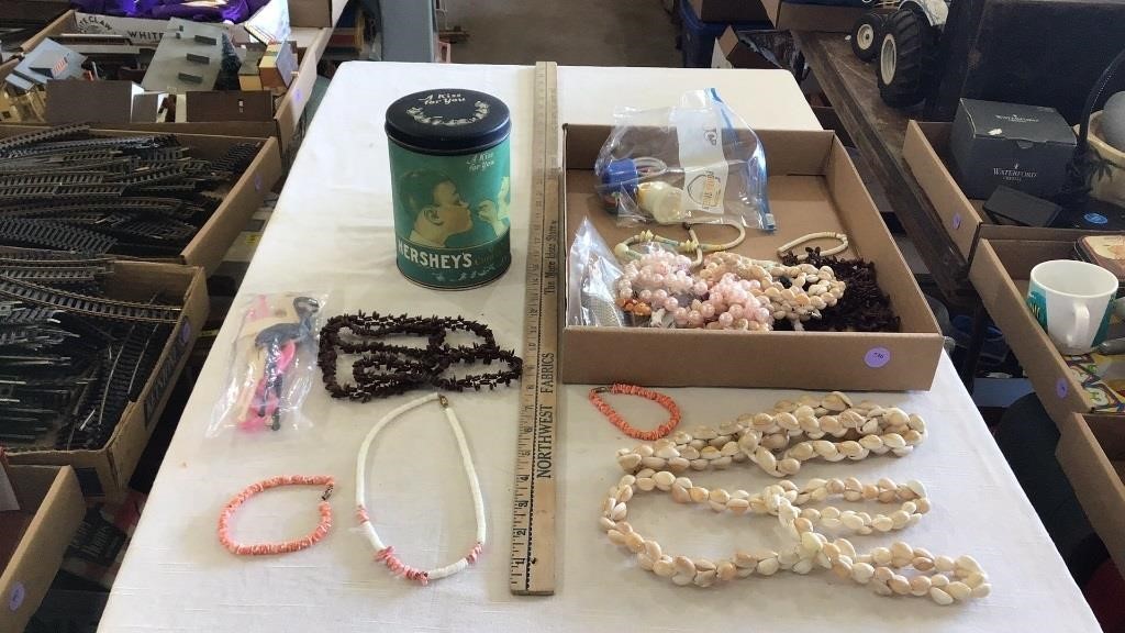 Necklaces and bracelets, vintage tin