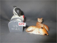 cat and bird figurines .