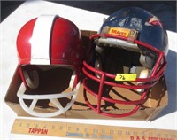 2 football helmets