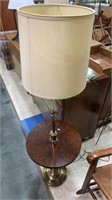 Brass and wood base side table floor lamp.