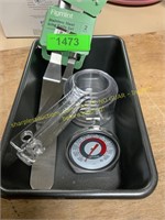 Bread pan, measuring cups, over thermometer