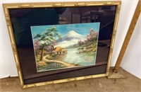 Needlework landscape in frame