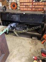 Tool bench with tools in drawers and shelves