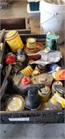 Tote of fishing reels, stain and cleaning spray