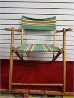 Vintage striped folding lawn chair.