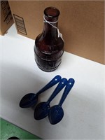 Vintage bottle and metal spoons