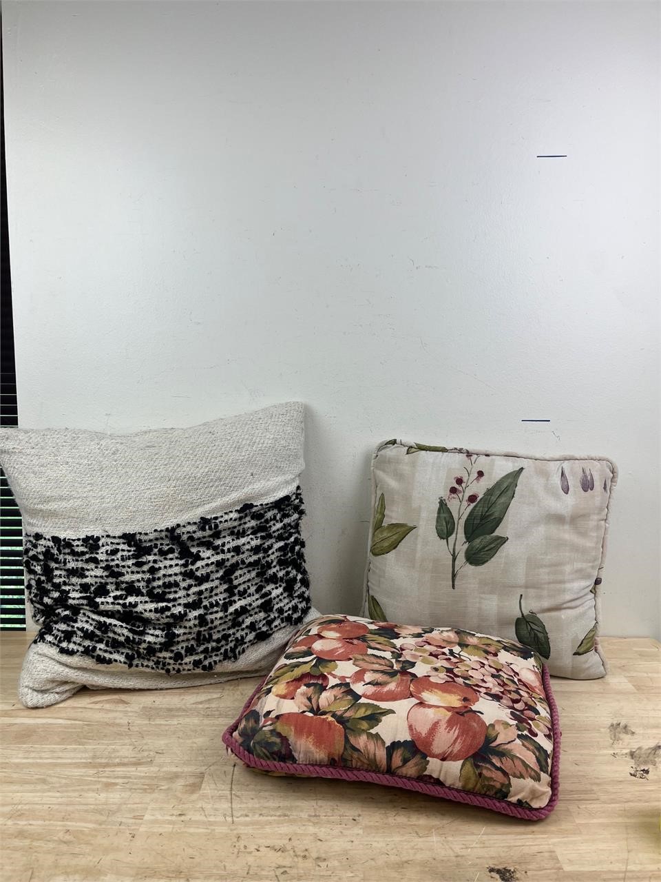 three decorative pillows