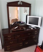 Cherry finish bureau with beveled mirror