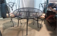 Wrought Iron Table and 2 chairs with Cushions