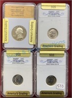 Group of four slabbed coins