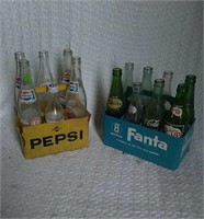 2 plastic crates with bottles