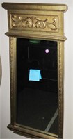 Mirror in vertical golden frame