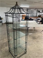 Ornate metal and glass tower shelf