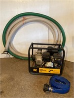 2” water pump. Like new. suction & discharge hoses