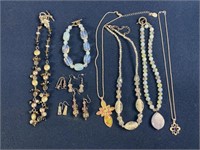 Costume Jewelry necklaces and earrings, one has a