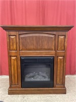 Freestanding Electric Fireplace. Wooden cabinet.