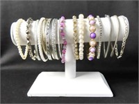 COLLECTION OF COSTUME BRACELETS: BANGLES, MOTHER-