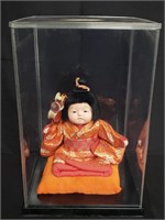 Geisha doll on plastic stand