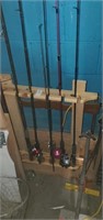 5 fishing rods with reels, 1 without.