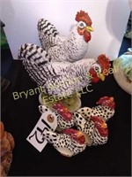 Two chickens and four napkin ring chickens