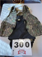 Hunting vest with built-in seat cushion & pouch,