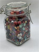 HINGED JAR OF ASSORTED BEADS