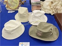 FOUR LADIES HATS WITH LIGHT COLORED RIMS
