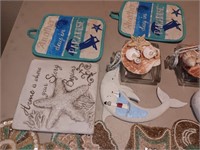 Nautical pot holder's bottle, dolphin and more.