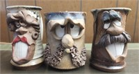 Lot of 3 pottery face mugs