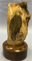 Fossilized scrimshaw of an eagle by Michael Scott