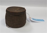 Early woven covered basket