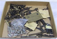 Assorted gun cleaning supplies, gun parts,