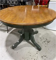 Green & stained wood pedestal table with one leaf