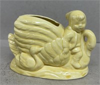 Child and duck vase