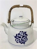 Porcelain tea kettle with wooden handle
