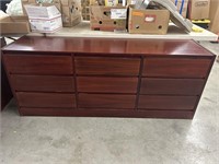 Wooden dresser with 9 drawers 69 in long 17 3/4