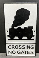 Crossing no gates cast iron sign