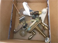 Box of used faucets
