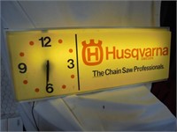 Lighted Husqvarna sign with clock