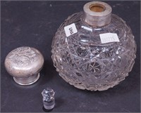 A cut glass perfume bottle with stopper and